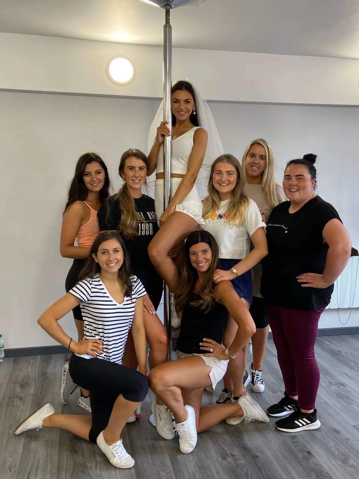 Hen party group dancing at a Pole Dancing dance class in Blackburn